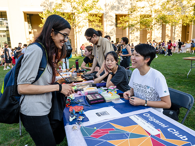 Student Origami Club table at The Activities Fair on The Cut
