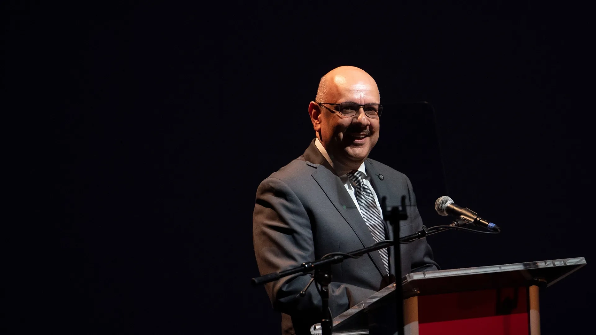 Farnam Jahanian speaking at a podium